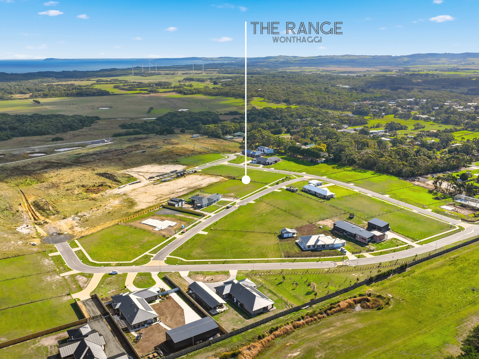 Aerial view of The Range subdivision and surrounding farmland toward the coast